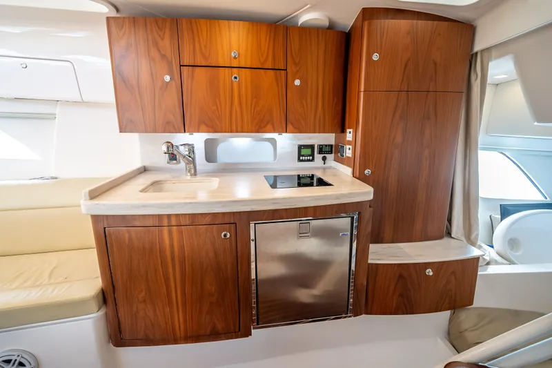  Yacht Photos Pics Luxurious 2018 Intrepid 407 yacht interior with modern kitchen and wooden cabinetry.