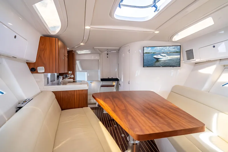  Yacht Photos Pics Luxurious interior of 2018 Intrepid 407 yacht with wood accents and modern amenities.