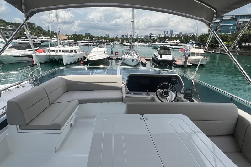 Yacht Photos Pics 2024 Galeon 440 Fly yacht interior with helm, seating, and marina view.