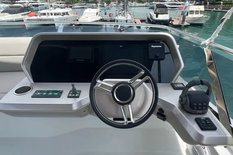  Yacht Photos Pics Helm of 2024 Galeon 440 Fly yacht with modern controls and steering wheel.