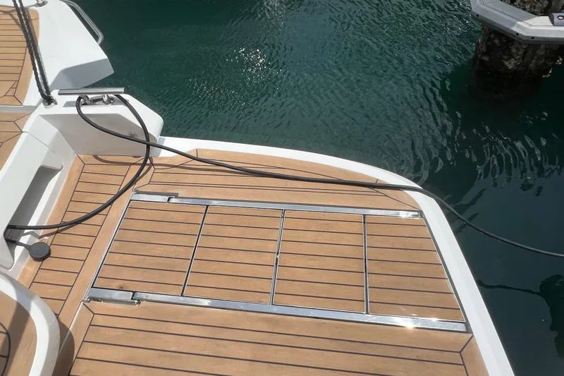  Yacht Photos Pics 2024 Galeon 440 Fly yacht deck with teak finish by the water.