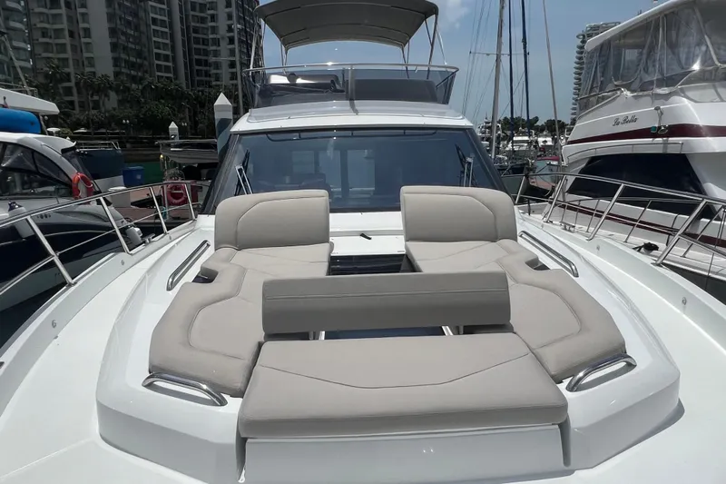  Yacht Photos Pics 2024 Galeon 440 Fly yacht with luxurious sunbathing area, docked in a marina.