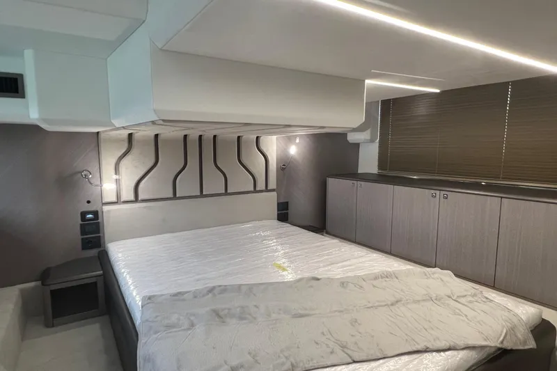  Yacht Photos Pics Luxurious bedroom interior of 2024 Galeon 440 Fly yacht with modern design elements.