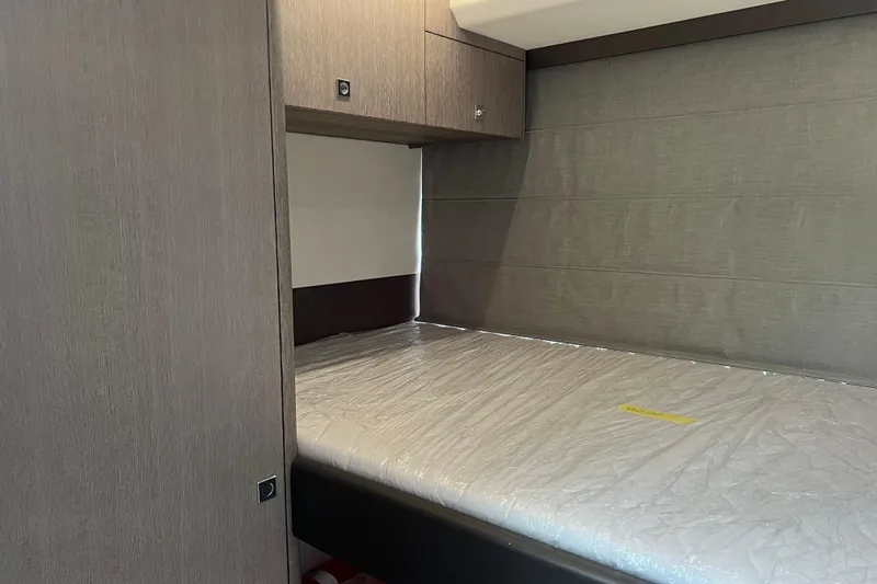  Yacht Photos Pics 2024 Galeon 440 Fly cabin interior with modern wood finish and bed.