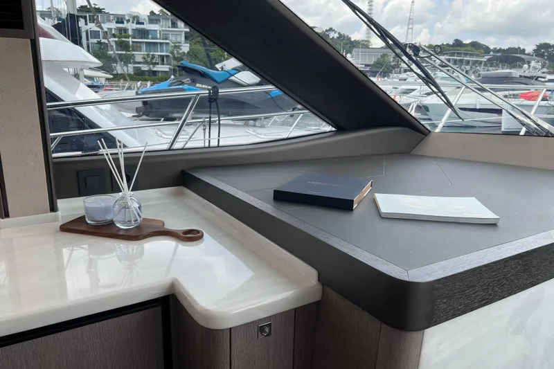 Yacht Photos Pics Luxurious interior of 2024 Galeon 440 Fly yacht with marina view.