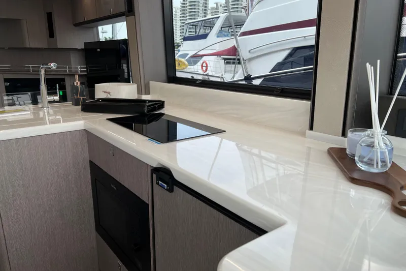  Yacht Photos Pics Modern kitchen interior of 2024 Galeon 440 Fly yacht with sleek countertops and appliances.