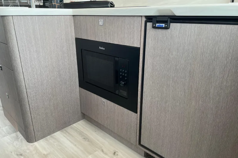  Yacht Photos Pics Modern kitchen area in 2024 Galeon 440 Fly yacht with built-in appliances.