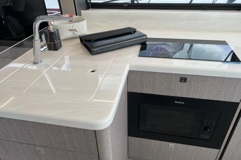  Yacht Photos Pics Modern kitchen area in 2024 Galeon 440 Fly yacht with sleek countertop and appliances.