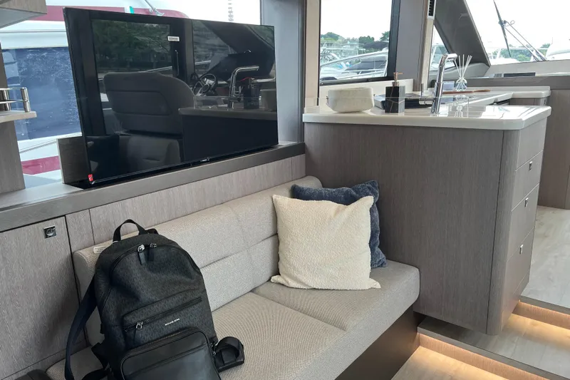  Yacht Photos Pics Interior of 2024 Galeon 440 Fly yacht with modern seating and sleek kitchen area.