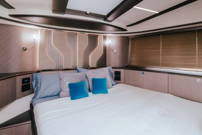  Yacht Photos Pics Luxurious bedroom interior of 2024 Galeon 440 Fly yacht with modern design and cozy bedding.