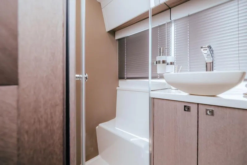  Yacht Photos Pics Luxurious bathroom interior of 2024 Galeon 440 Fly yacht with modern fixtures.