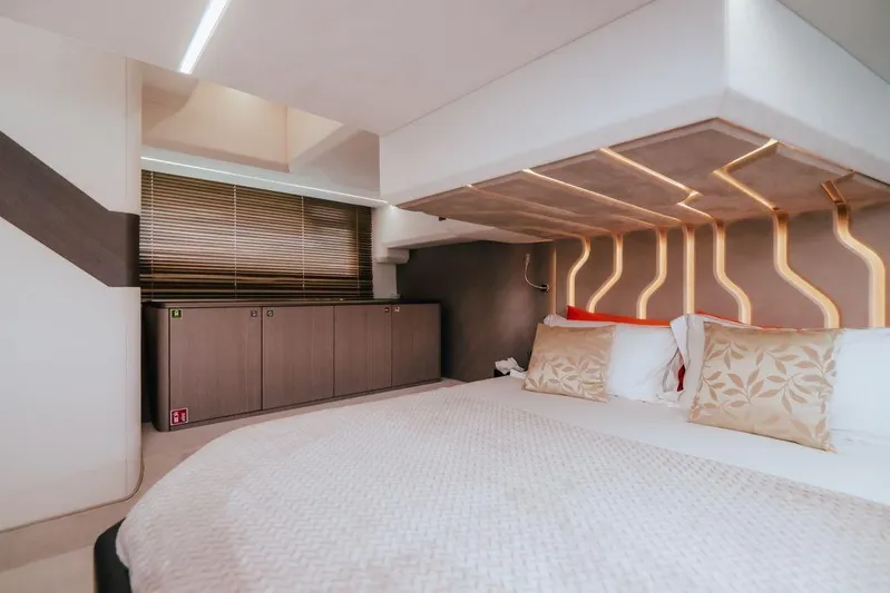  Yacht Photos Pics Luxurious bedroom interior of 2024 Galeon 440 Fly yacht with modern design elements.