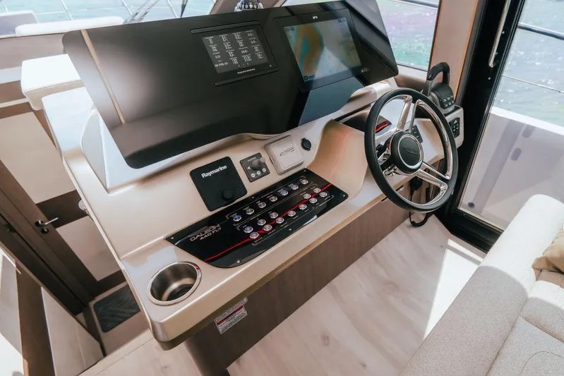  Yacht Photos Pics 2024 Galeon 440 Fly yacht helm with modern navigation controls and steering wheel.