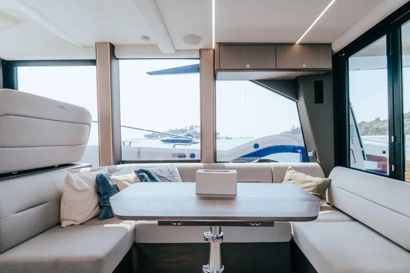  Yacht Photos Pics Luxurious interior of 2024 Galeon 440 Fly yacht with modern seating and large windows.
