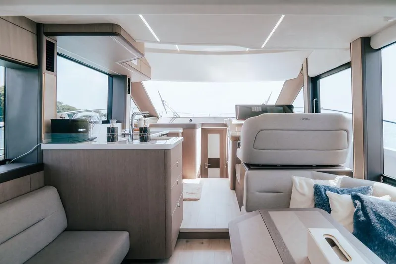  Yacht Photos Pics Luxurious interior of 2024 Galeon 440 Fly yacht with modern furnishings and panoramic windows.