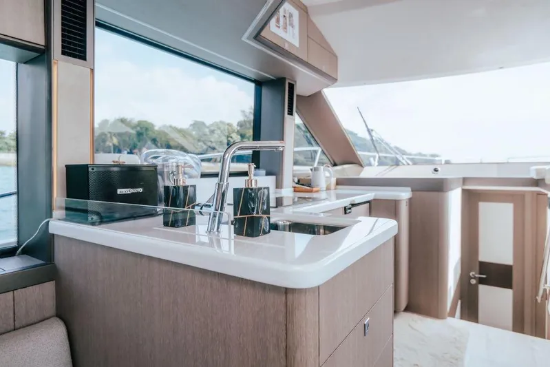  Yacht Photos Pics Luxurious interior of 2024 Galeon 440 Fly yacht with modern kitchen amenities.