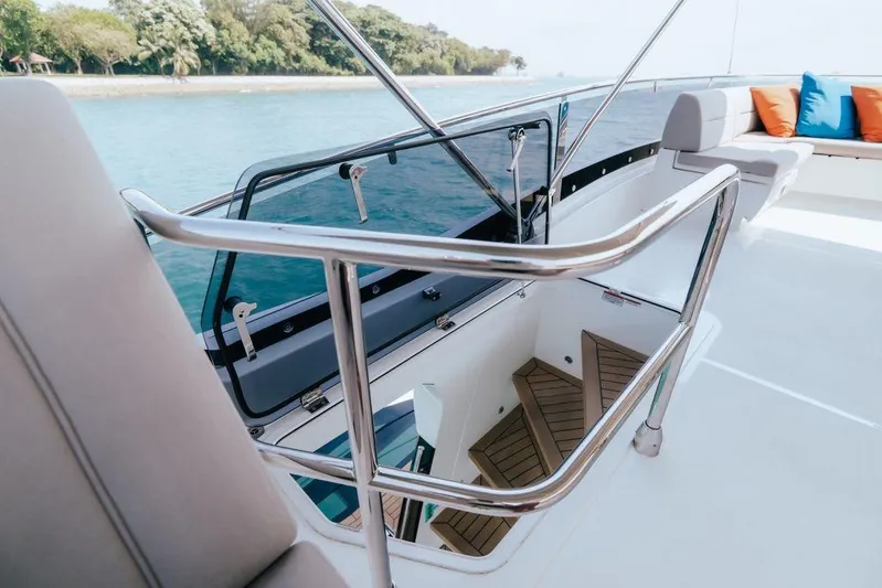  Yacht Photos Pics 2024 Galeon 440 Fly yacht deck with stairs and seating area.