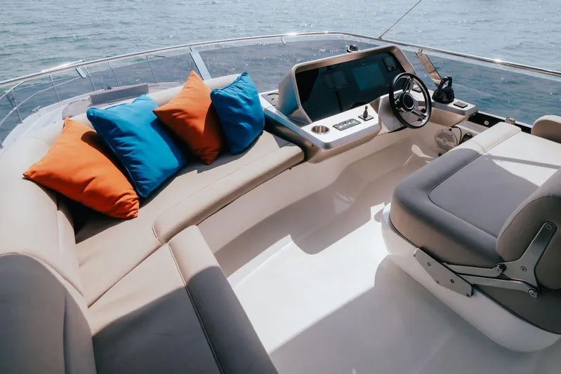  Yacht Photos Pics Luxurious 2024 Galeon 440 Fly yacht interior with colorful cushions and modern helm.