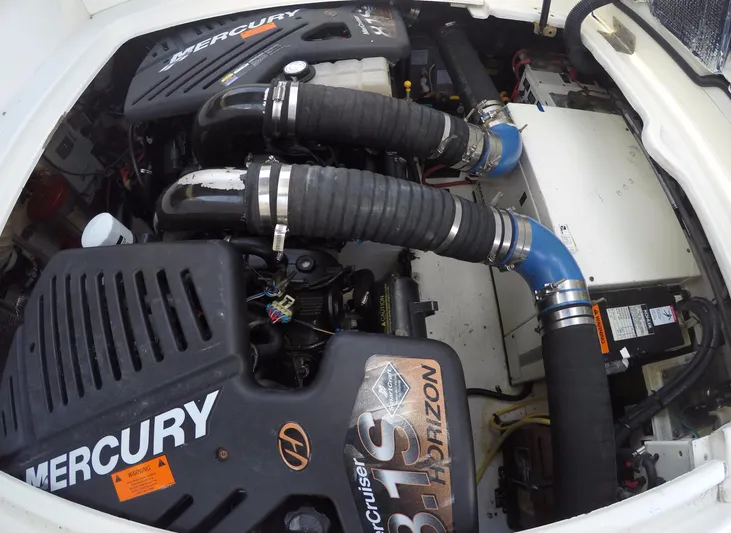 Grand Cru Yacht Photos Pics Engine compartment of 2005 Cruisers Yachts 340 Express with Mercury engines.