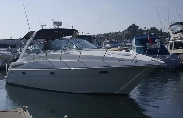 Grandcru Yacht Photos Pics 2005 Cruisers Yachts 340 Express docked, sleek design.