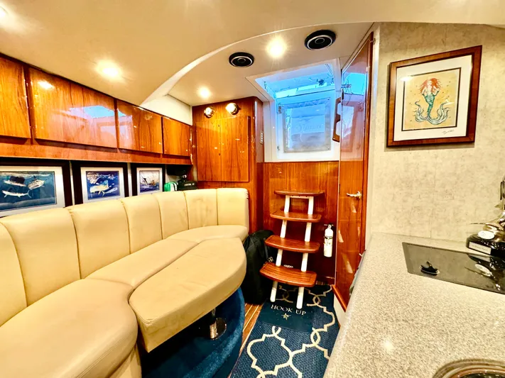 Hook Up Yacht Photos Pics Luxurious interior of a 2004 Predator 35 yacht with elegant seating and wooden accents.