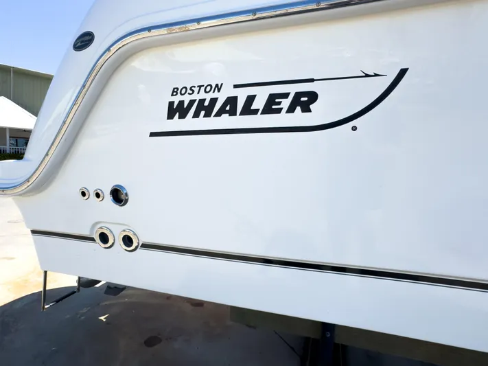 Pearl Yacht Photos Pics 2018 Boston Whaler 315 Conquest boat exterior with logo and sleek design.