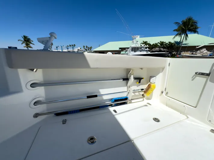 Pearl Yacht Photos Pics 2018 Boston Whaler 315 Conquest deck with storage compartments and fishing rod holders.