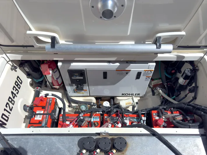 Pearl Yacht Photos Pics Engine compartment of 2018 Boston Whaler 315 Conquest with Kohler generator and batteries.