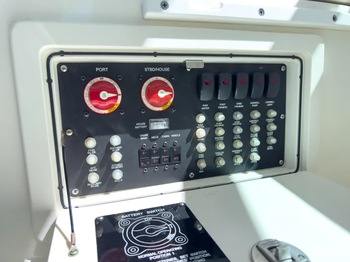 Pearl Yacht Photos Pics Control panel of a 2018 Boston Whaler 315 Conquest boat, featuring switches and gauges.
