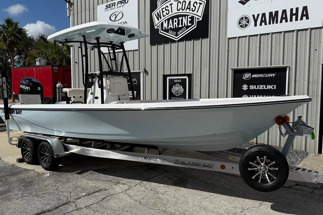 2026 Blazer PureBay 2400 boat on trailer at West Coast Marine dealership.