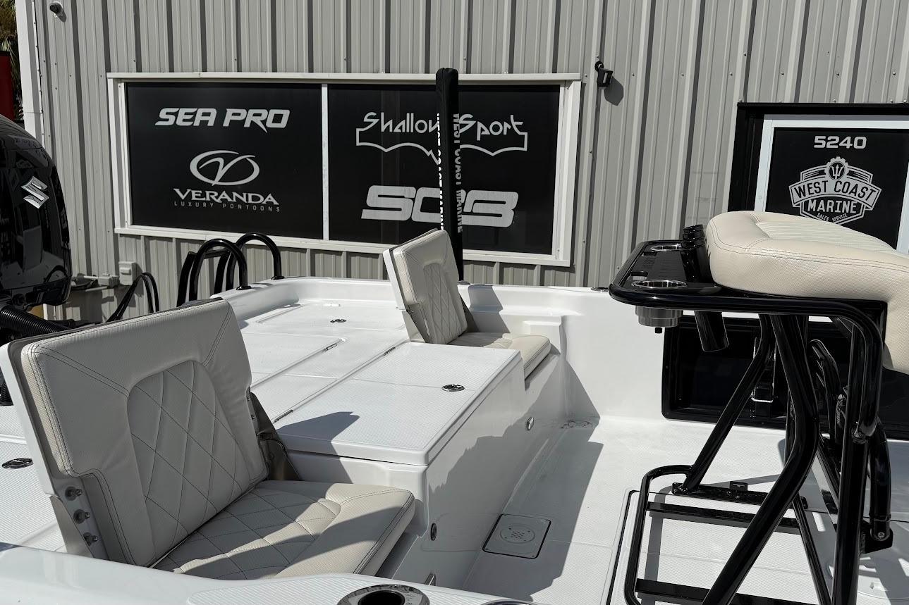 2026 Blazer PureBay 2400 boat interior with white seating and black accents.