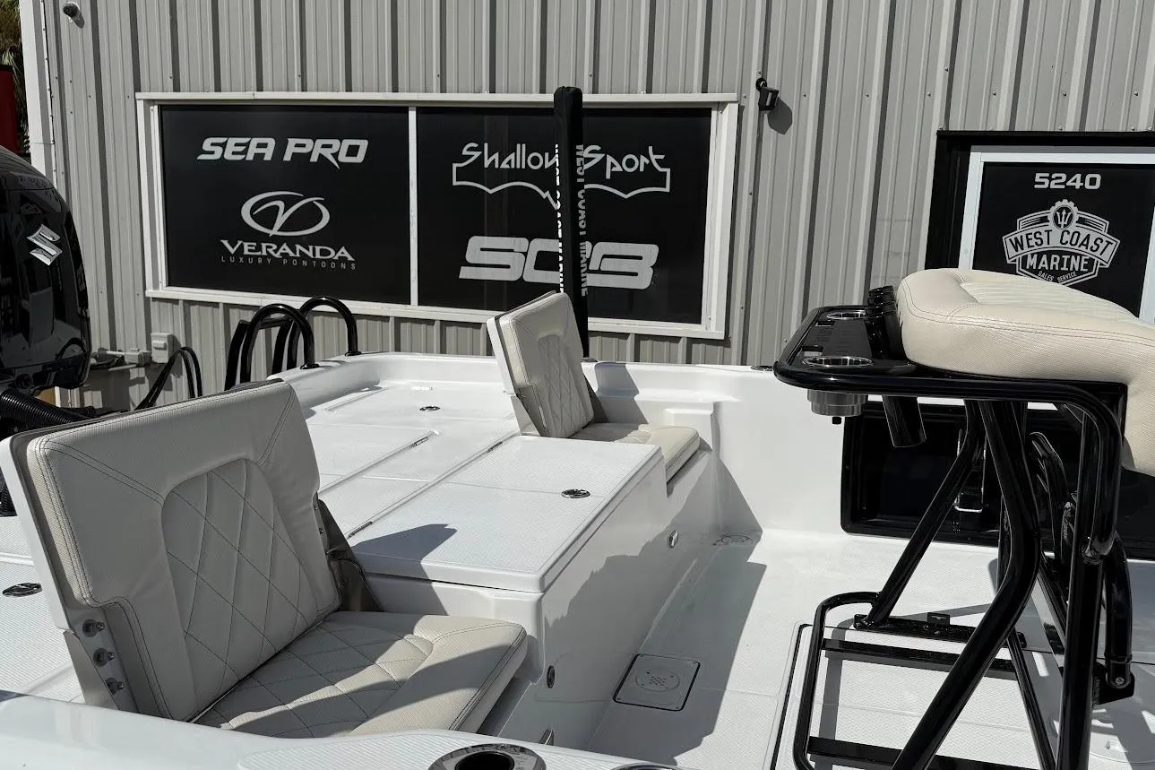 2026 Blazer PureBay 2400 boat interior with white seating and black accents.