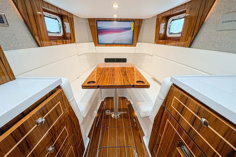  Yacht Photos Pics Manufacturer Provided Image: Luxurious interior of 2026 HCB 48 Campeon yacht with elegant wood finishes and seating.