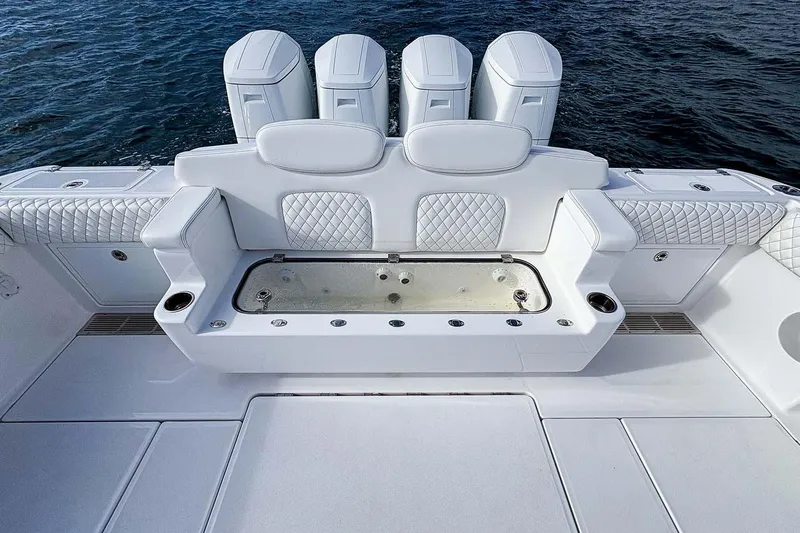  Yacht Photos Pics Manufacturer Provided Image: Luxury seating and storage on 2026 HCB 48 Campeon boat, with quilted upholstery and cup holders.