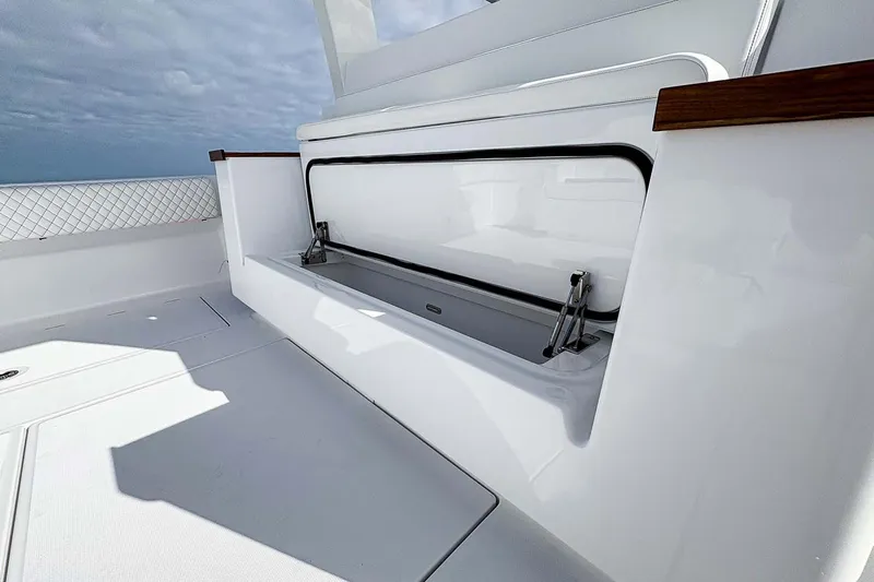  Yacht Photos Pics Manufacturer Provided Image: 2026 HCB 48 Campeon boat interior with open storage compartment.
