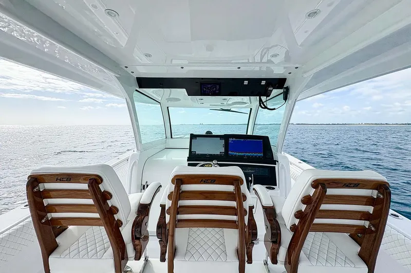  Yacht Photos Pics Manufacturer Provided Image: Interior view of 2026 HCB 48 Campeon boat with luxurious seating and ocean backdrop.