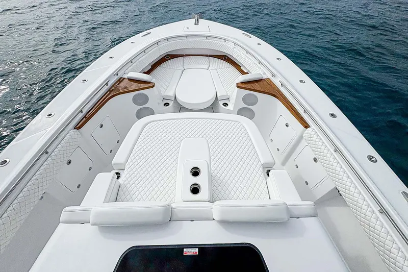  Yacht Photos Pics Manufacturer Provided Image: Luxurious 2026 HCB 48 Campeon boat interior with white quilted seating on the water.