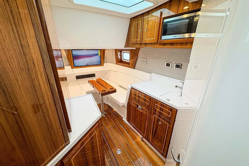  Yacht Photos Pics Manufacturer Provided Image: Luxurious interior of 2026 HCB 48 Campeon yacht with wood finishes and modern amenities.