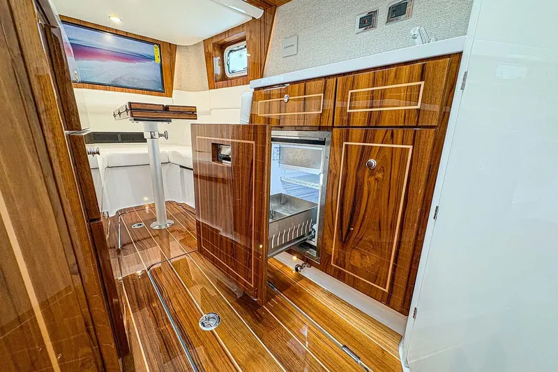  Yacht Photos Pics Manufacturer Provided Image: Luxurious interior of 2026 HCB 48 Campeon yacht with wood finish and modern amenities.