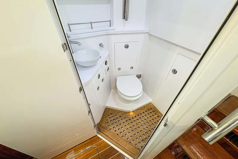  Yacht Photos Pics Manufacturer Provided Image: Luxurious bathroom in 2026 HCB 48 Campeon yacht with modern fixtures and wooden flooring.