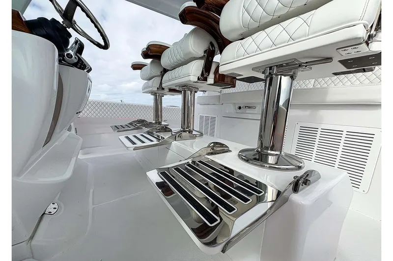  Yacht Photos Pics Manufacturer Provided Image: Luxurious interior of 2026 HCB 48 Campeon boat with sleek seating and chrome accents.
