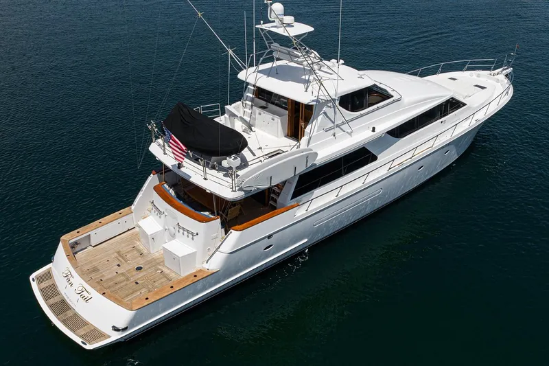 Fan Tail Yacht Photos Pics 2003 West Bay Sonship yacht on calm water, aerial view.