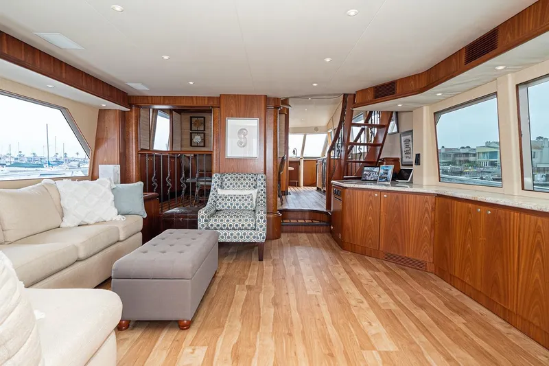 Fan Tail Yacht Photos Pics Luxurious 2003 West Bay Sonship yacht interior with elegant wood finishes and comfortable seating.