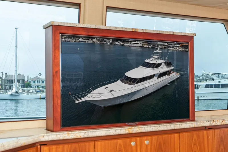Fan Tail Yacht Photos Pics 2003 West Bay Sonship yacht displayed on a framed screen inside a luxurious cabin.