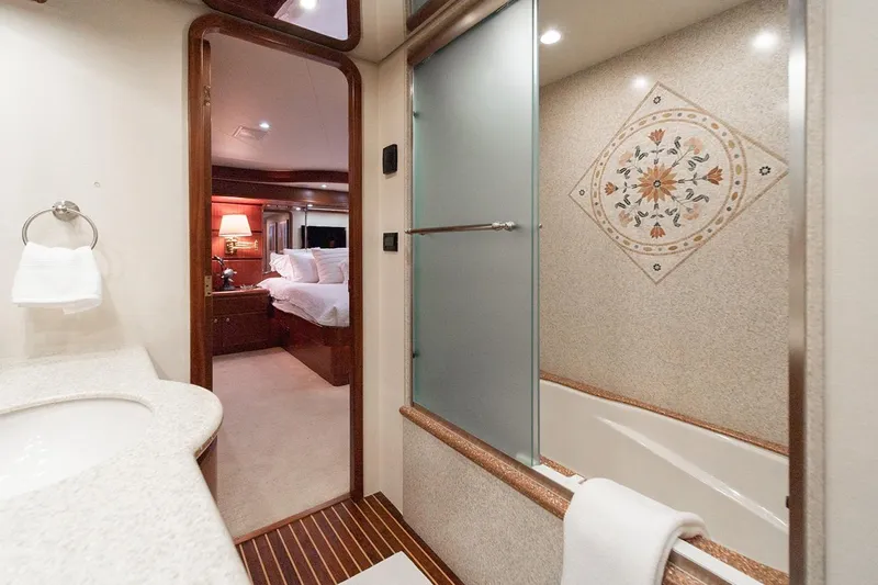 Fan Tail Yacht Photos Pics Luxurious 2003 West Bay Sonship yacht bathroom with elegant design and bedroom view.