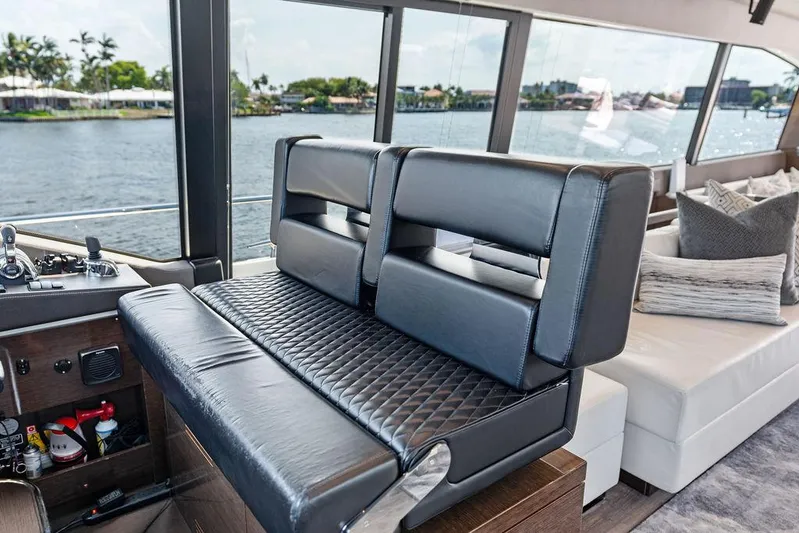  Yacht Photos Pics Luxurious interior of 2018 Prestige 680 yacht with leather seating and scenic water view.