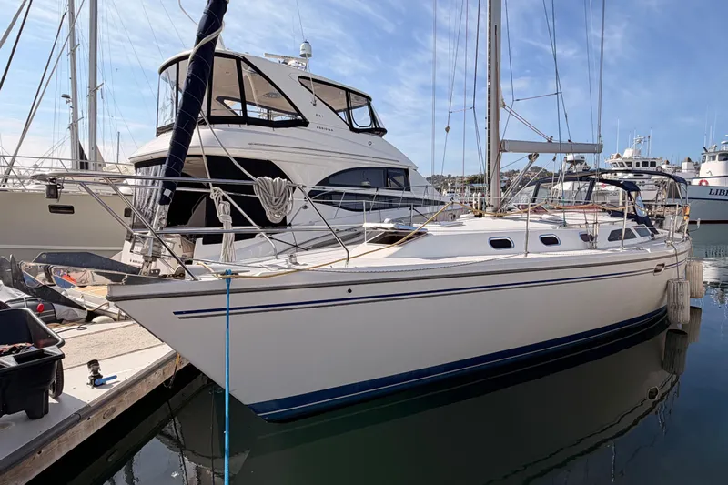 Seaduction Yacht Photos Pics 2005 Catalina 42 MkII sailboat docked in a marina, side view.
