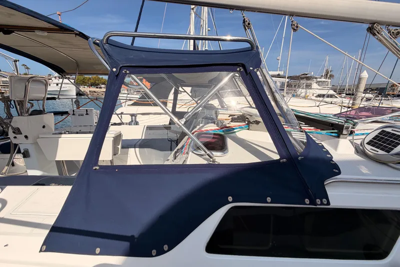 Seaduction Yacht Photos Pics 2005 Catalina 42 MkII sailboat cockpit with blue canvas cover in marina setting.