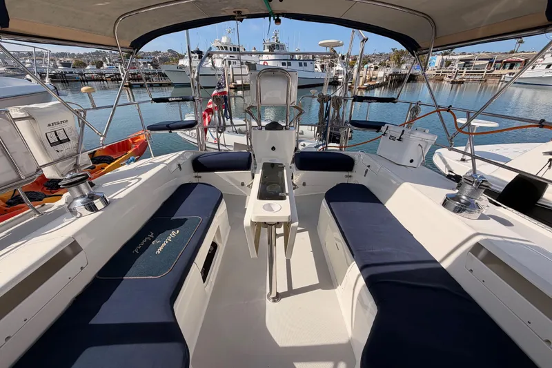 Seaduction Yacht Photos Pics Cockpit of 2005 Catalina 42 MkII sailboat with blue seating, docked at marina.