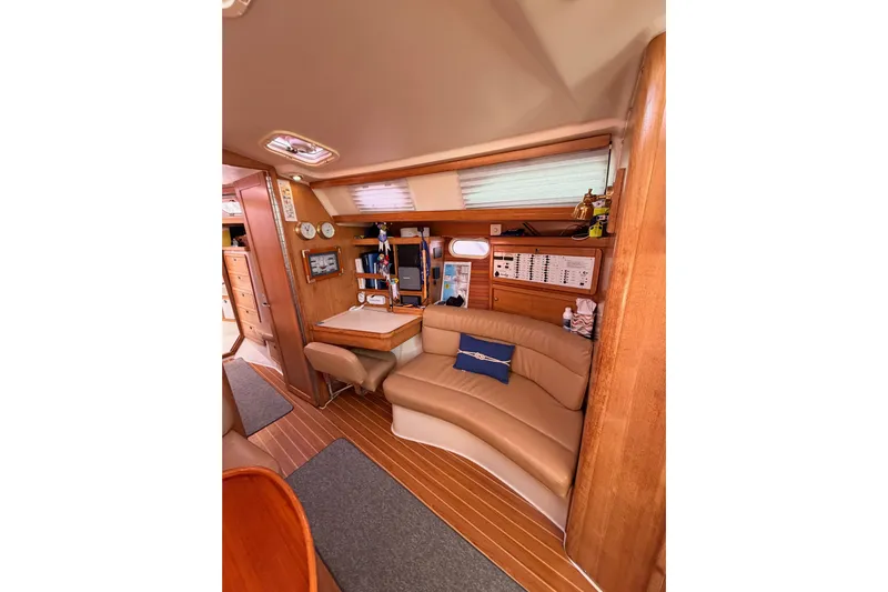 Seaduction Yacht Photos Pics Interior of 2005 Catalina 42 MkII sailboat with cozy seating and navigation area.